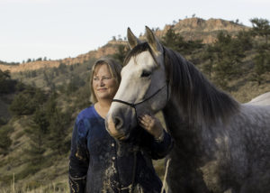 Carol and her Adobe Town mustang Mica